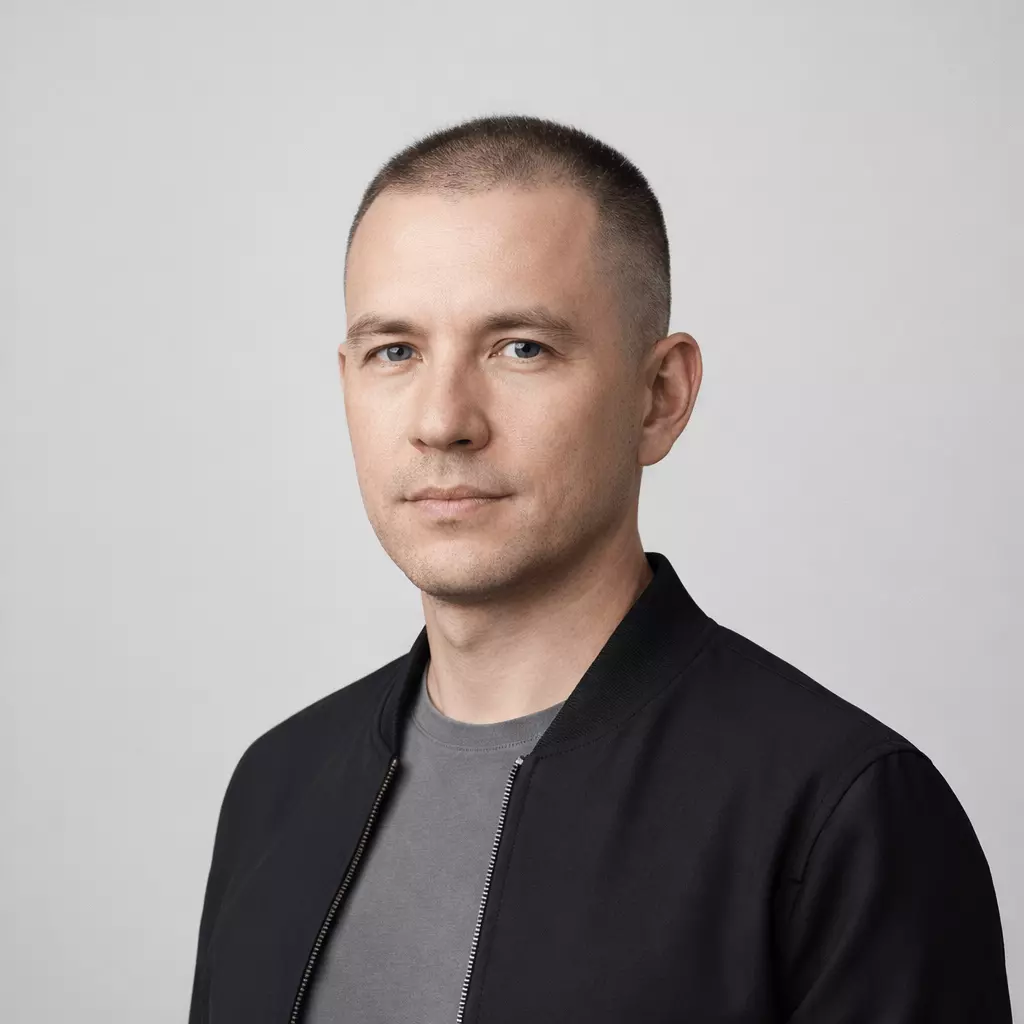 Man with diffuse thinning hair wearing #1 high and tight buzz cut, confident, minimalist look.