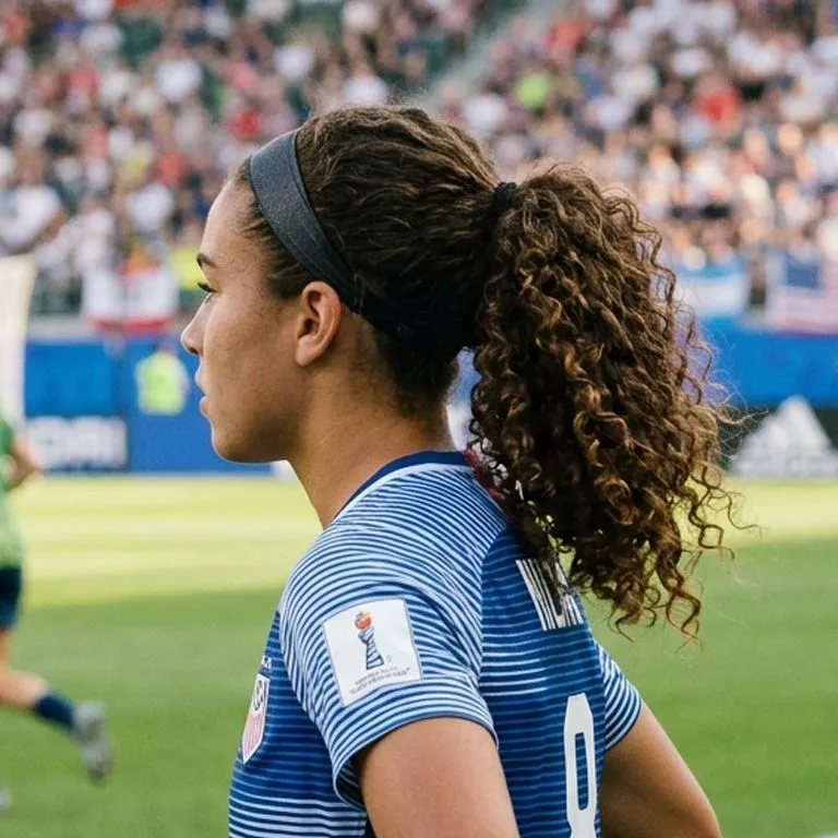 Curly ponytail with headband easy soccer hairstyle