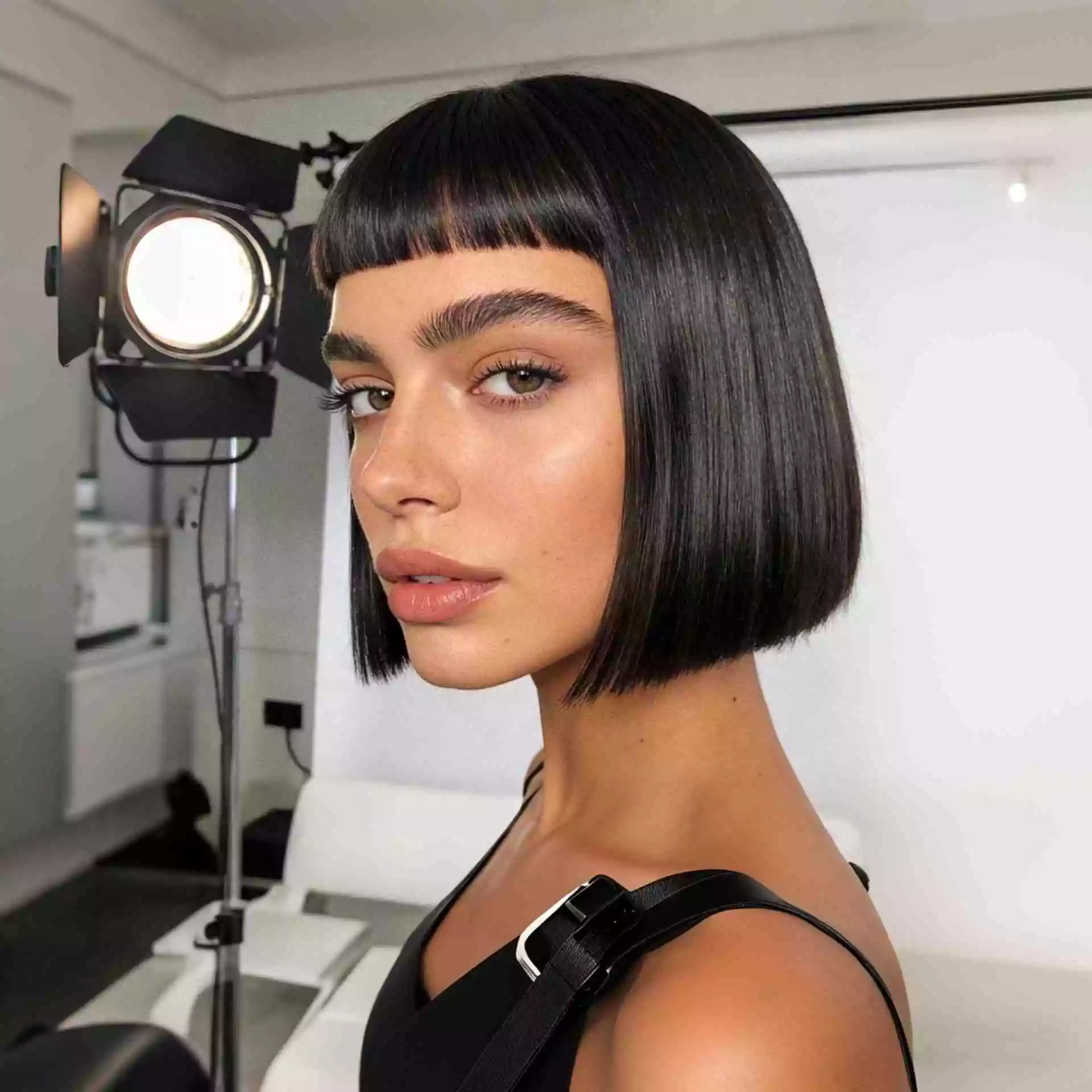 Micro bangs French bob haircut 2026 ultra-short dramatic baby fringe