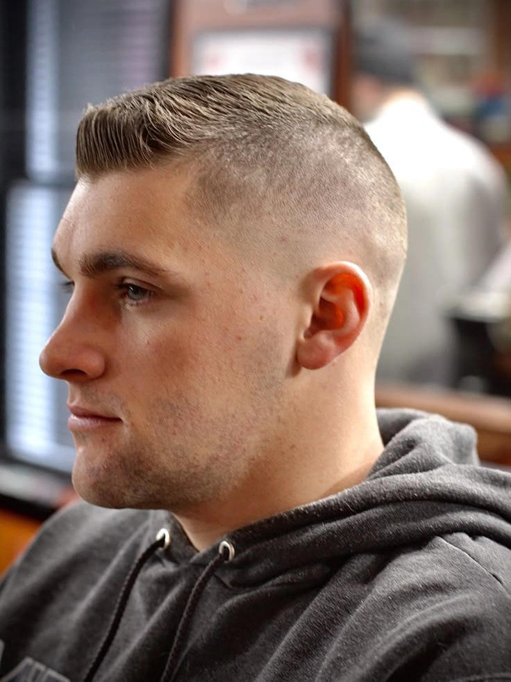 Brush cut hairstyle - short buzzed hair standing up like a brush