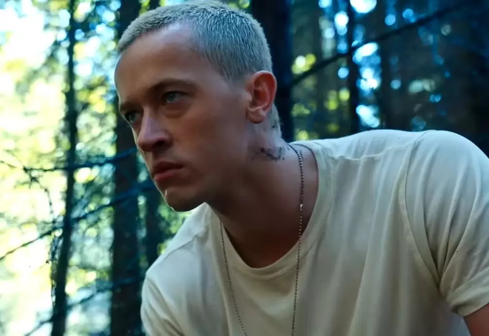 Tom Blyth close cropped buzz cut natural hairline low fade cinematic daylight portrait Peacekeeper Snow transformation