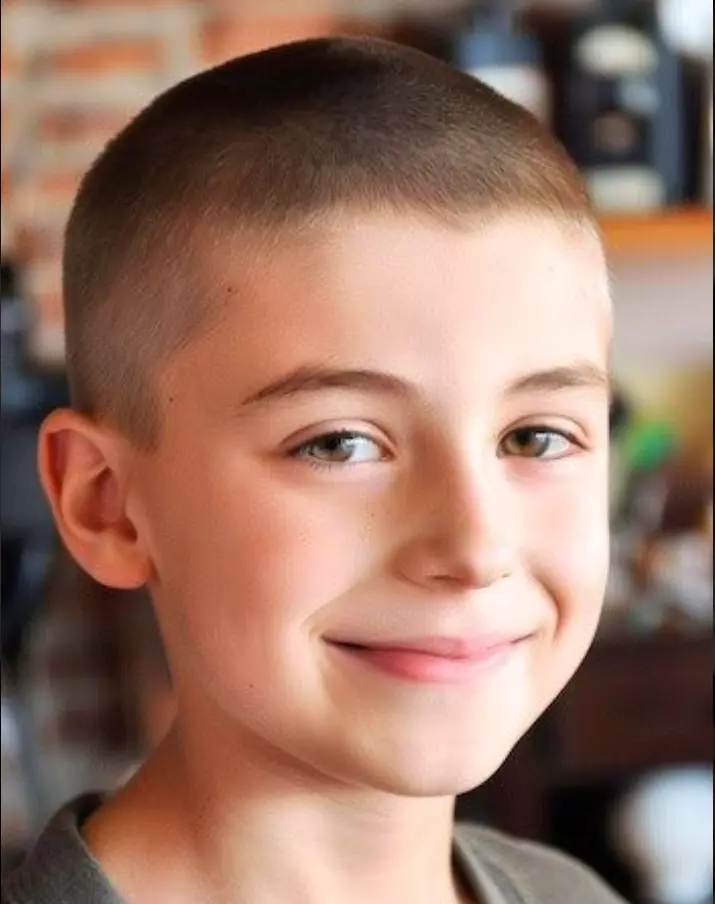 a boy with a buzz cut