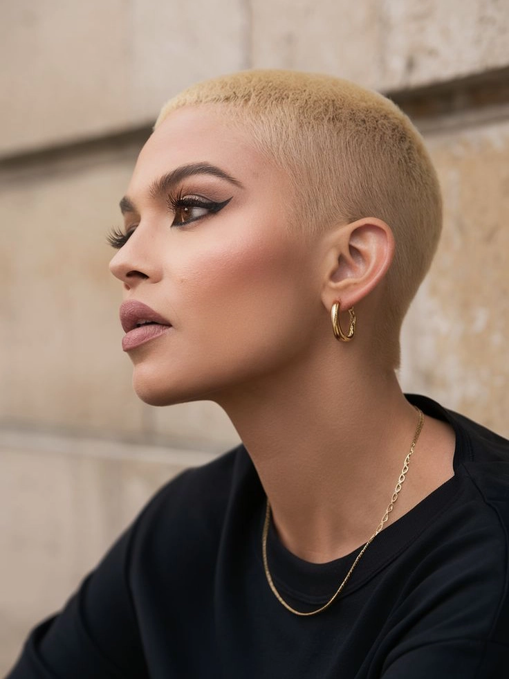 Women’s buzz cut, sharp jawline and defined features