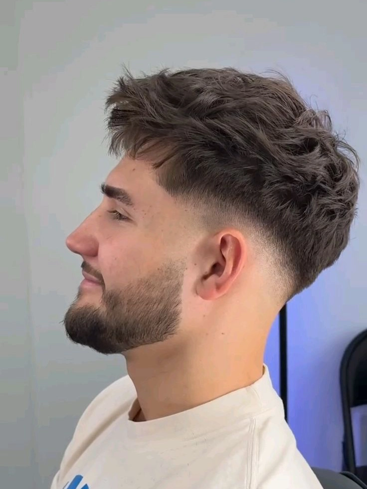 Low taper fade haircut diagram showing gradual hair transition from ears to crown