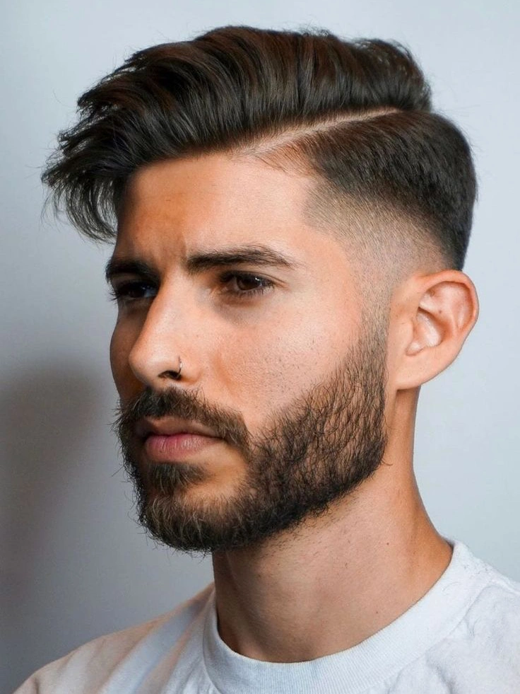 Professional side part low taper fade with hard line for square faces