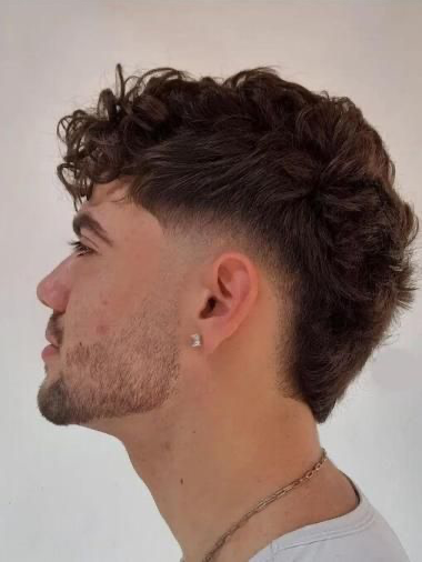 Curved drop low taper fade haircut showing neckline transition