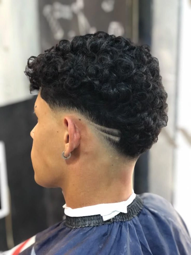 Geometric design low skin fade with simple spiked top hair